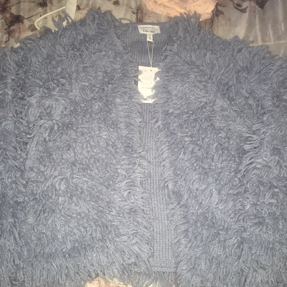 A baby blue wool blend knit sweater